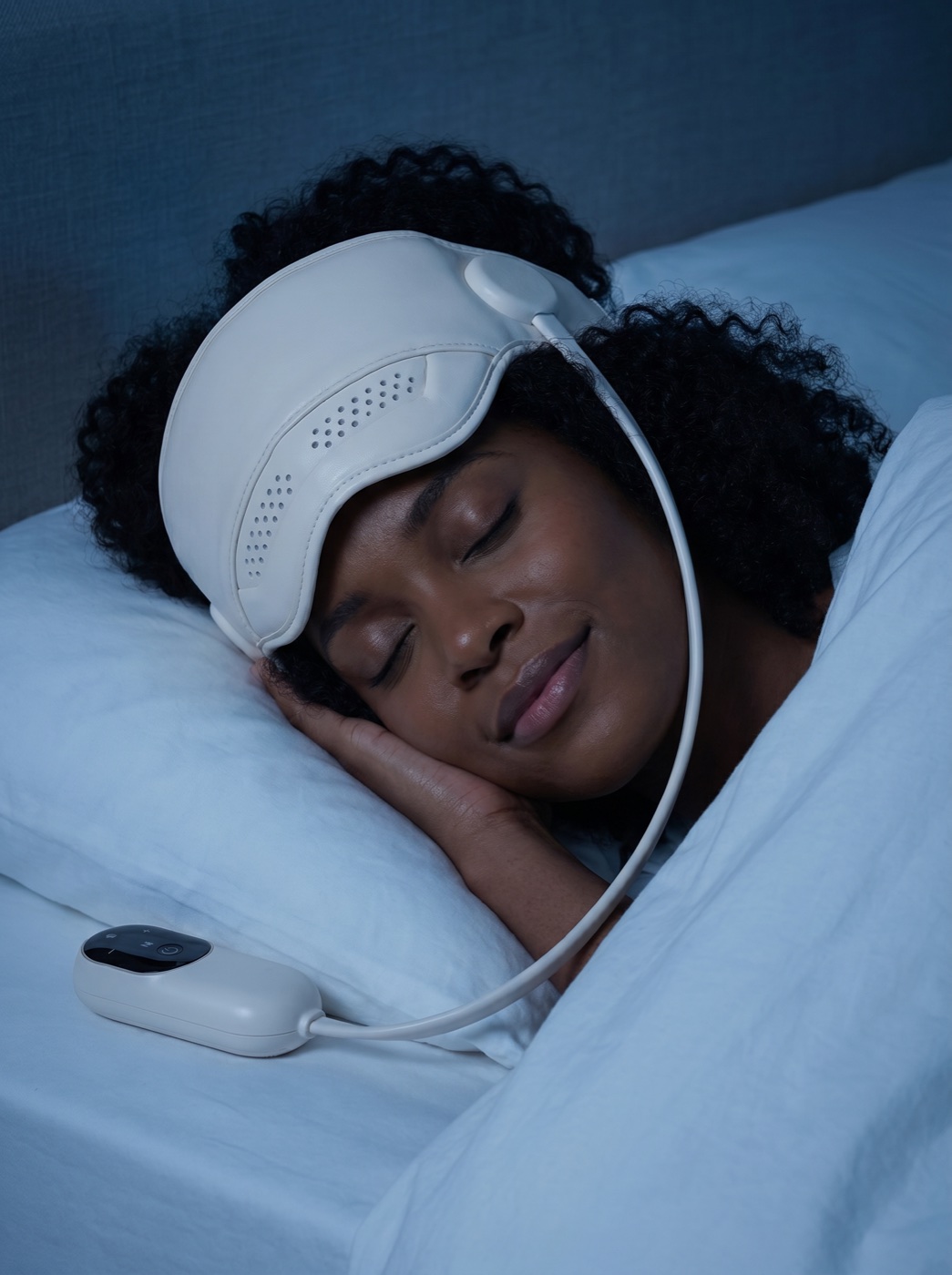 Hannah resting at night with Kalmely on, eyes closed